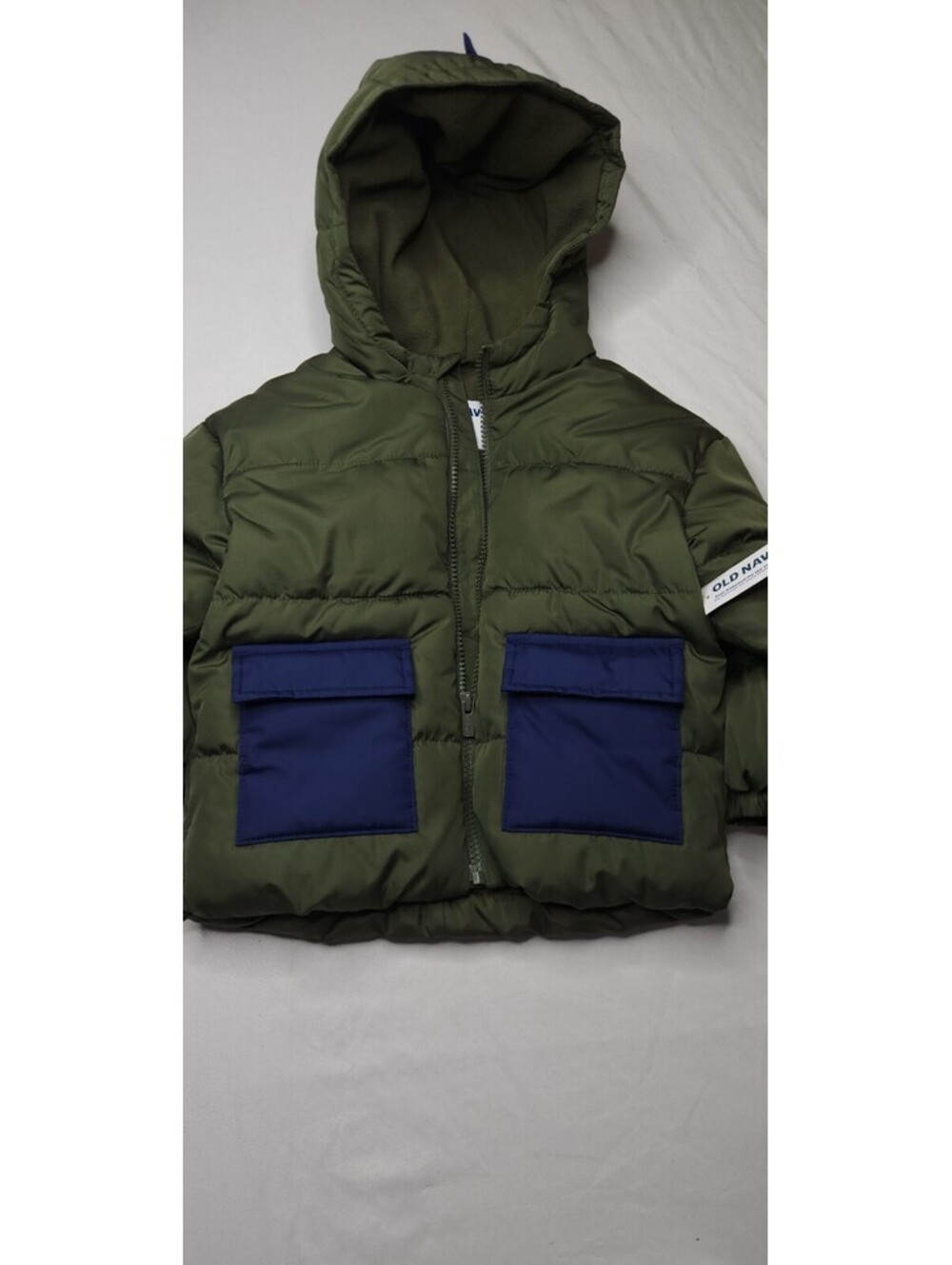 Old Navy olive green hooded puffer vest with blue pockets